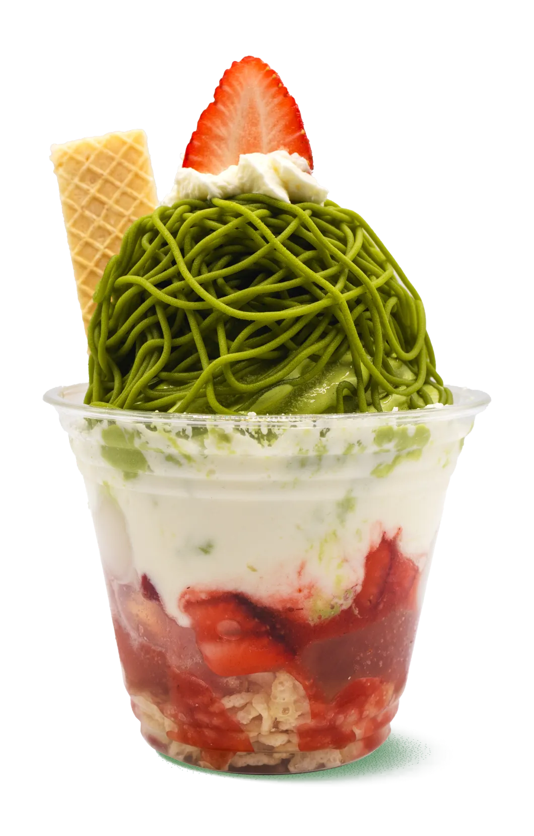 Layered matcha-strawberry parfait in a clear cup. Red strawberries and cake at bottom, white cream in middle, and green matcha noodles on top with waffle cone decoration. A colorful Japanese-fusion dessert.